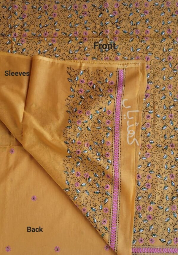 Detailed close-up of hand embroidery on back of lawn shirt