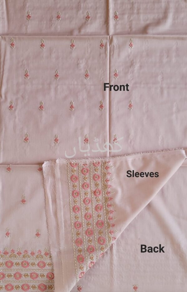 Back of embroidered sand pink shirt with peach floral threadwork