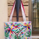 hand-embroidered-tote-bag-depicting-tropical-birds-flowers-and-lush-greenery-front-rk00067