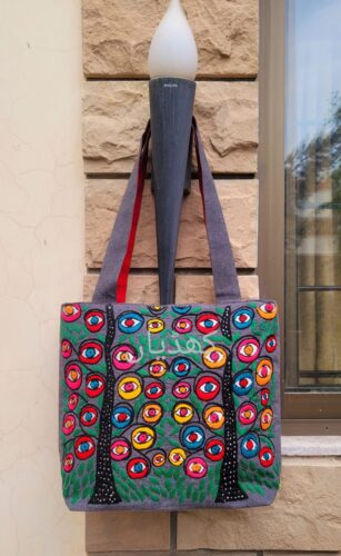 limited-edition-hand-embroidered-tote-bag-vibrant-ethnic-art-vivid-eye-motifs-pakistan