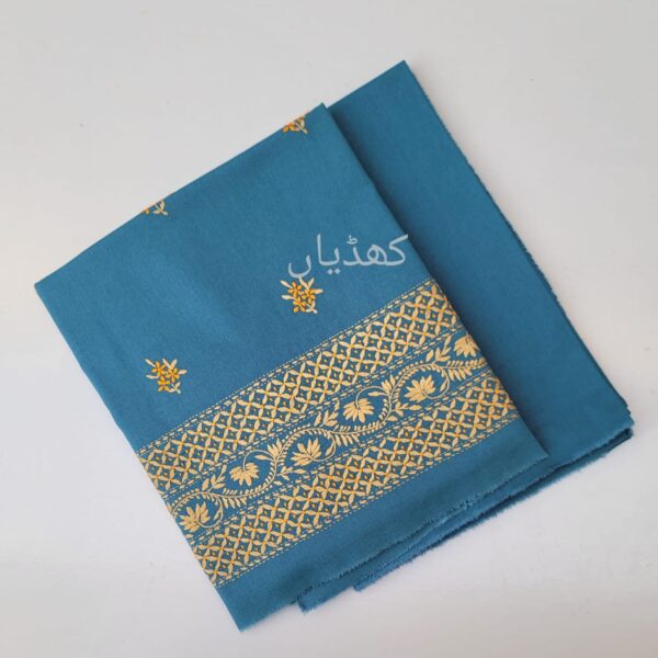 Cerulean blue ensemble with hand embroidered pale primrose border and motifs