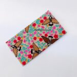Starling Garden embroidered wallet with colorful bird and floral embroidery on a Beige base