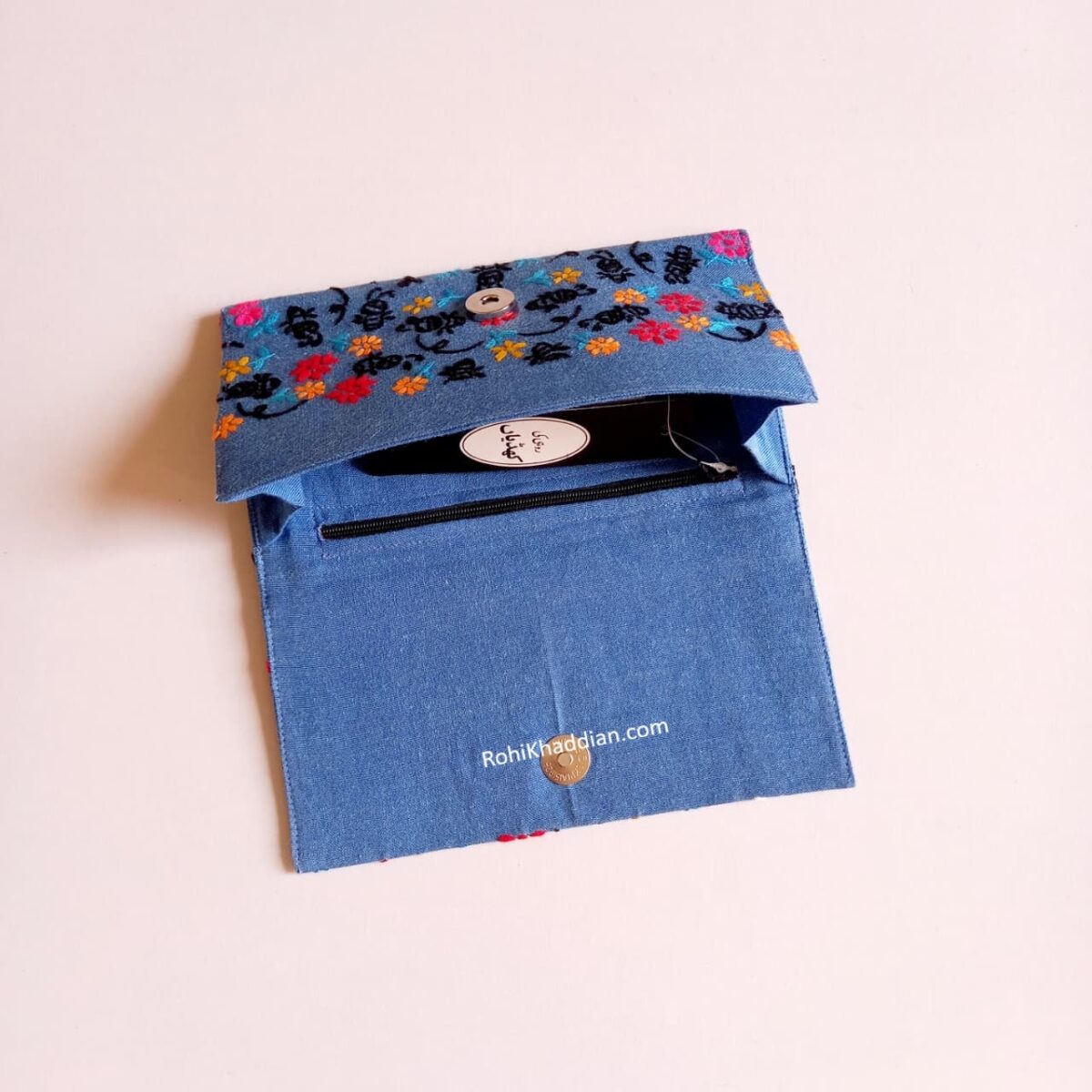 Blue Night Florals embroidered clutch for women with colorful floral motifs and a compact 4 x 8 inch design