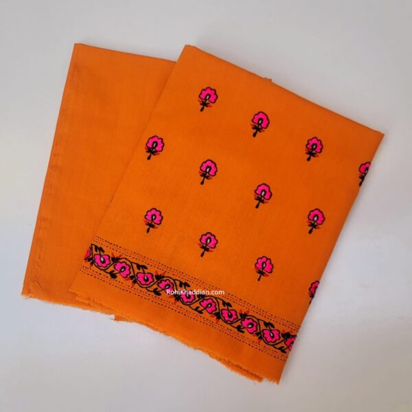 Mandarin orange hand embroidered cotton suit with pink floral motifs and decorative border by Rohi Ki Khaddian Pakistan