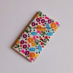 Midsummer Garden embroidered wallet for women with colorful floral embroidery on an Ivory Cream background