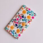 Sunflower Grove embroidered wallet for women with colorful sunflowers and floral embroidery on an ivory white base